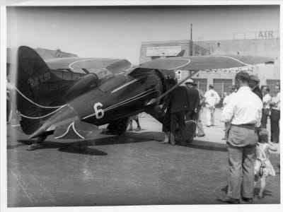 Hall Bulldog at Roosevelt Field NY with group, right rear view, August 26, 1932